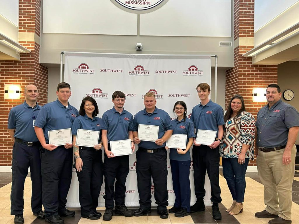students stand with their certificates for SMCC Workforce Training